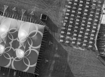 Aerial shot of an event stadium setup, showcasing the stage and seating arrangements.